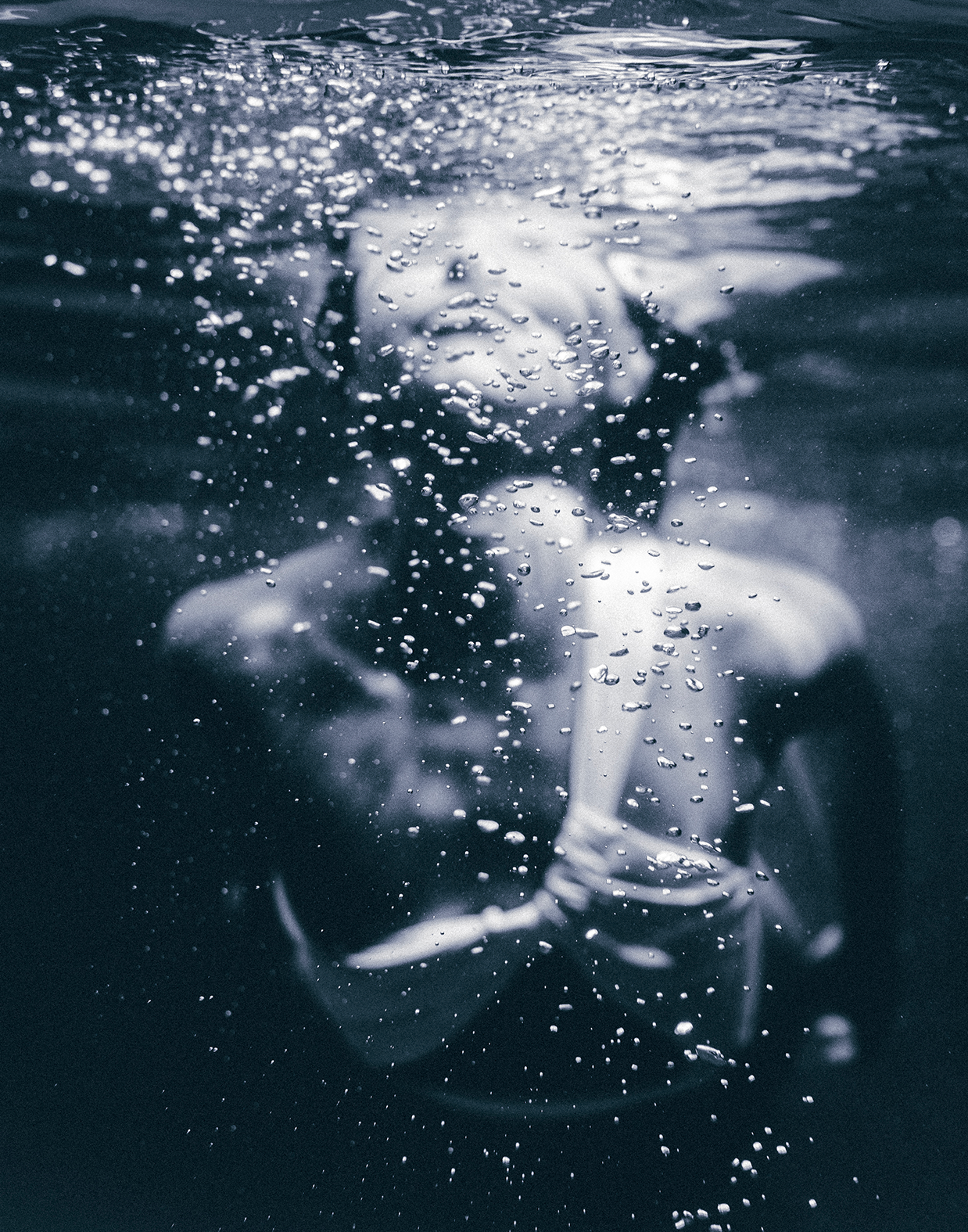 Close-up of a single green leaf against a white background.