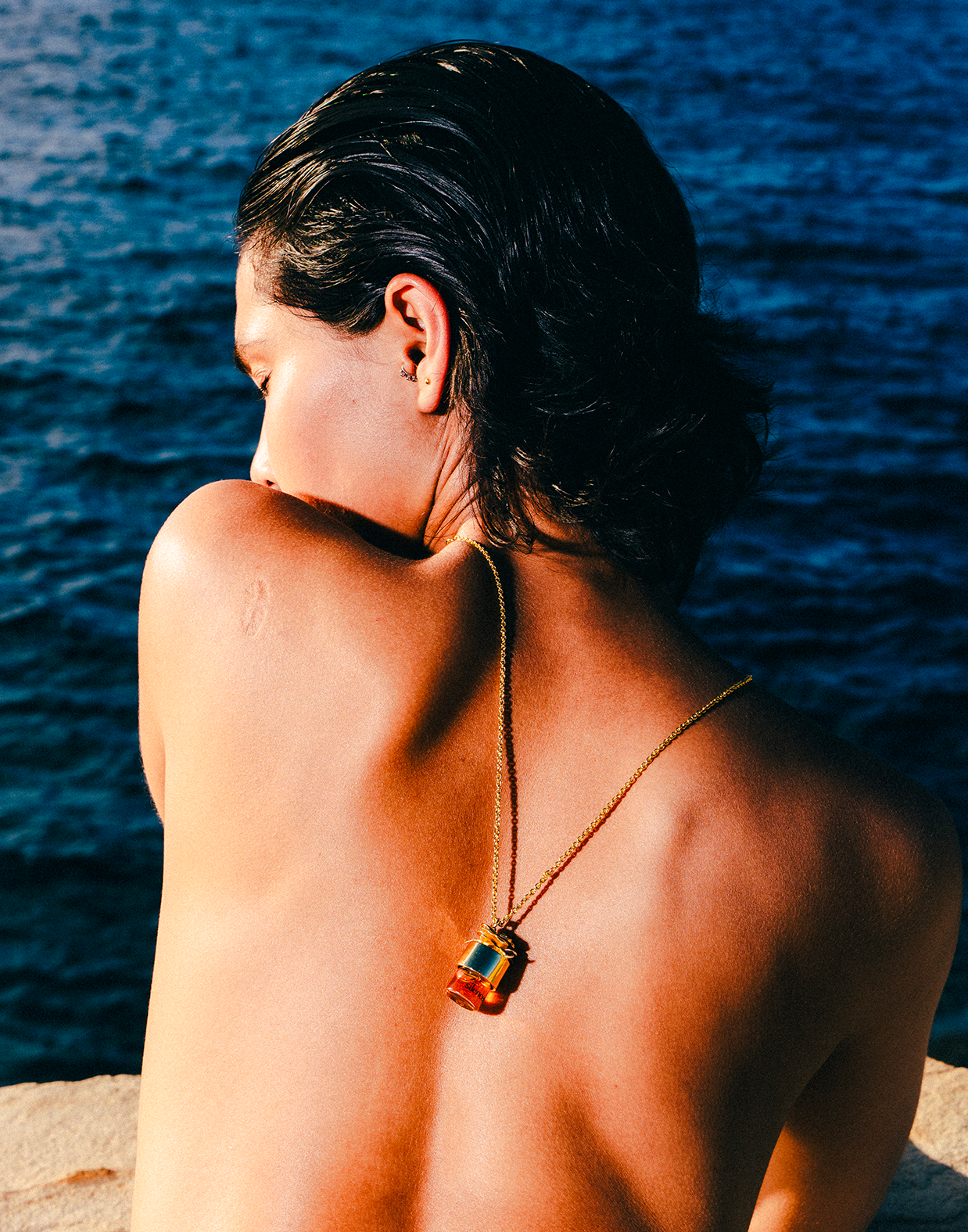 Close-up of a single green leaf against a white background.