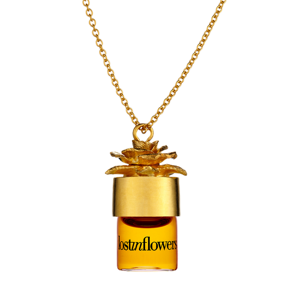 lostinflowers potion pendant carrying your favorite perfume in a gold necklace. Necklace allows you to substitute fragrances at your desire.