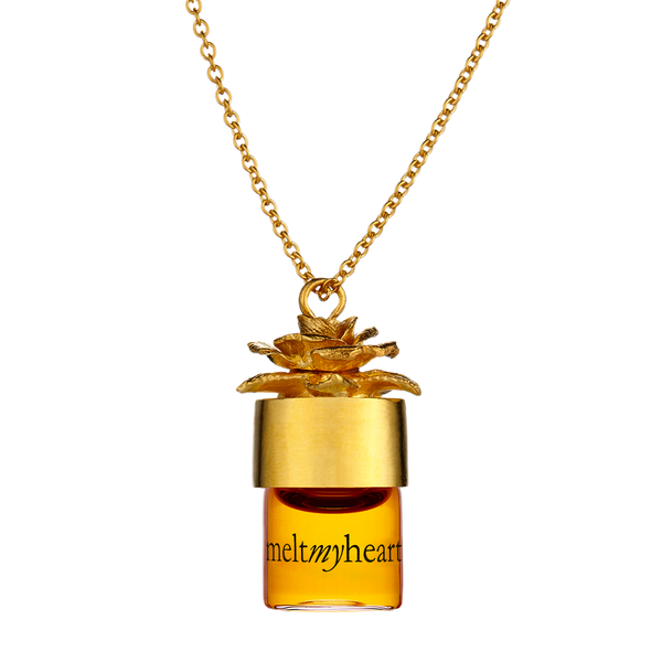 meltmyheart potion pendant carrying your favorite perfume in a gold necklace. Necklace allows you to substitute fragrances at your desire.