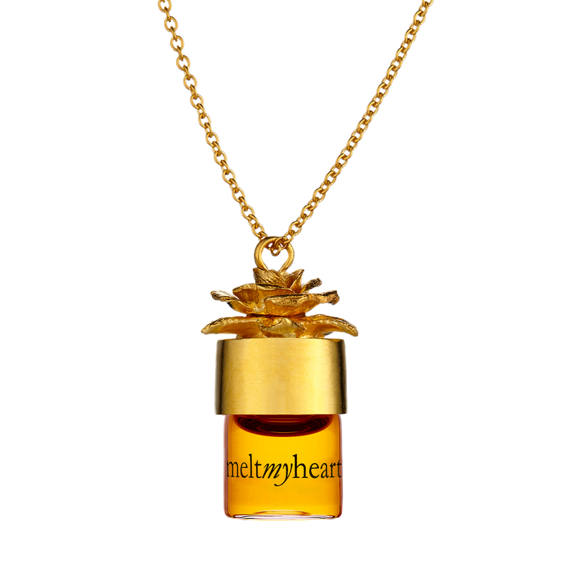 meltmyheart potion pendant carrying your favorite perfume in a gold necklace. Necklace allows you to substitute fragrances at your desire.