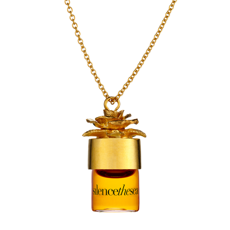 silencetthesea potion pendant carrying your favorite perfume in a gold necklace. Necklace allows you to substitute fragrances at your desire.